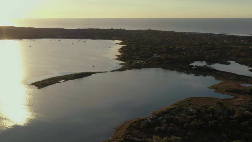 Stationary aerial shot over Montauk Lake in Montauk New York at the end of Long Island at sunrise