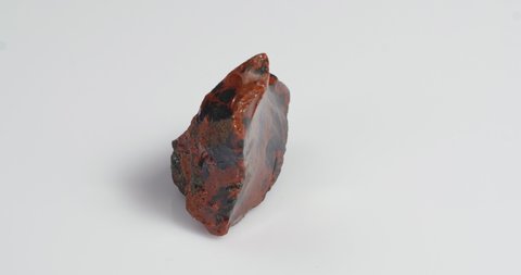 Obsidian mahogany. Igneous rock. Rotation on a white background.