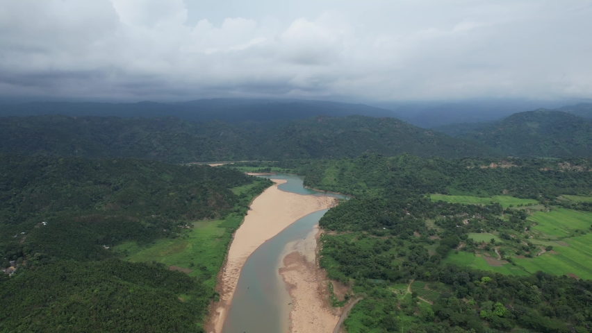 The lush green waterways of the northern province of Bangladesh, close to the Indian border and the Indian Meghalaya hill area and mountains Royalty-Free Stock Footage #1081079291