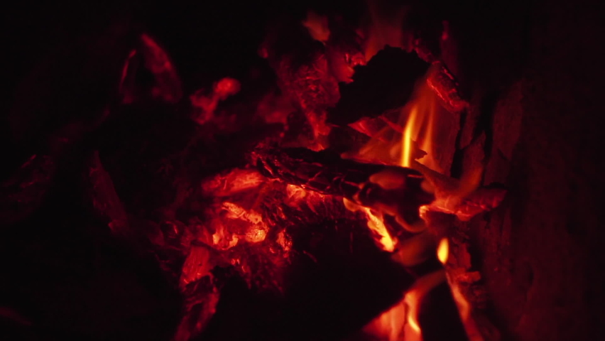 Dry woods smolder in bright camp bonfire in slow motion, with orange flame generating heat on wild beach at dark late night in Vietnam extremely closeup Royalty-Free Stock Footage #1081084109
