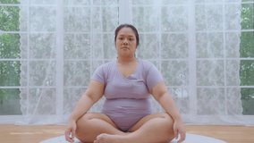 Asian woman oversize big chubby girl enjoy yoga with basic stretching. Start taking care of your health by playing light sports. diet healty and weight loss at home concept.
