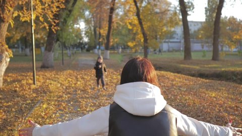Happy family moments. Mom and son walk in autumn park. Happy family on autumn walk. People in park. Happy family concept. Happy kid love for mom. Friendly family concept.