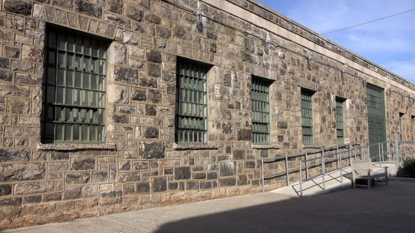 Administration building with ramp and barred windows at prison.