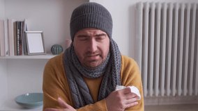 Video about one man suffering from cold at home and problem with house heating
