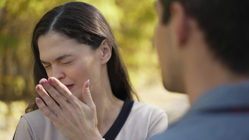 Bad breath. Woman covers her nose and turns away Royalty-Free Stock Footage #1081101980