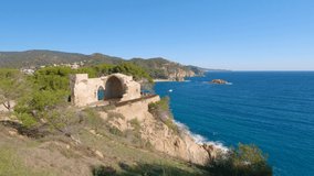 4K video of Tossa de Mar fishing village on the Costa Brava of Gerona near Barcelona Spain European medieval tourism turquoise blue water beach