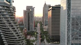 Cinematic aerial pull out shot, drone flying above Songgao road with high-rise skyscrapers and apartment complex alongside at sunset in downtown Xinyi district, Taipei city, Taiwan. - Powered by Shutterstock - Get 15% off with code: PIKWIZARD15