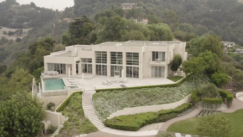 Beverly Hills , CA , United States - 10 21 2021: Pull in on Beverly Hills mansion.