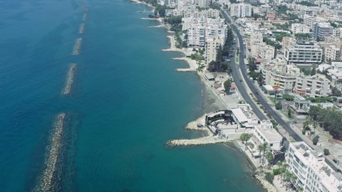 Limassol, Cyprus, September 2021: Aerial view Limassol Cyprus. The coastline along which there are skyscrapers and there is a road on which cars go.