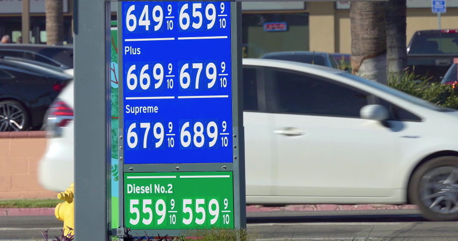 Record high gas prices at the  gas stations pump in 2021, Los Angeles. Cars traffic during rush hour, 4K Royalty-Free Stock Footage #1081111607