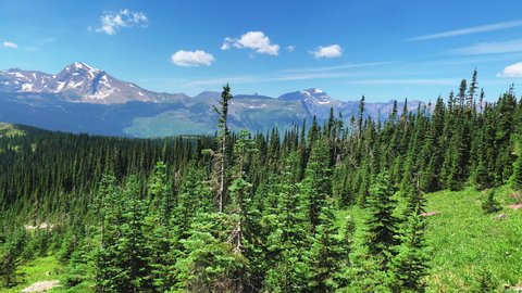 Camera captures 360 degree view of the Highline Trail Logan Pass and highlights its beautiful mountains and valley.