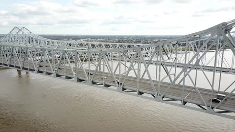Cars Driving Across Crescent City Connection Spanning Mississippi River In New Orleans, Lousiana, USA. - aerial