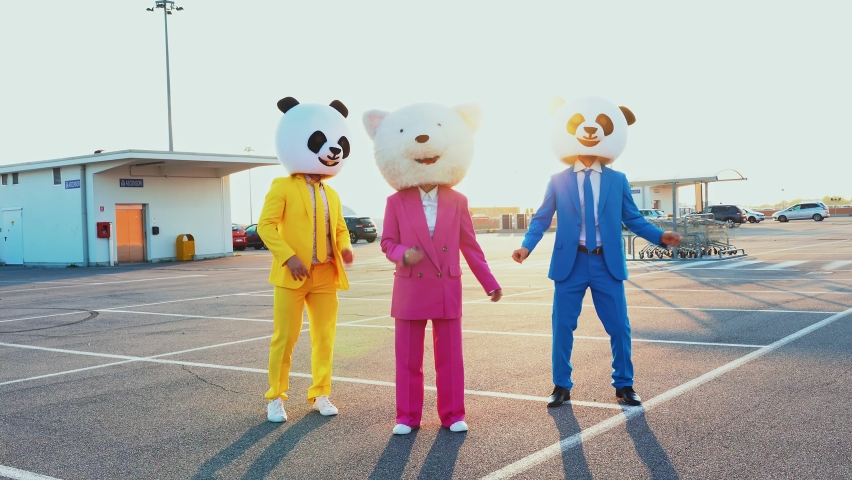 Funny people wearing panda costume and bear giant head having fun outdoor dancing and going crazy. | Shutterstock HD Video #1081131866