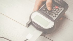 Animation of euro banknotes falling over hand of caucasian man holding payment terminal. finance, money, no cash payments safety digital generated video. - Powered by Shutterstock - Get 15% off with code: PIKWIZARD15