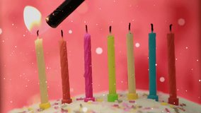 Animation of dots flying over lighter and birthday candles. birthday, festivity and celebration concept digitally generated video.
