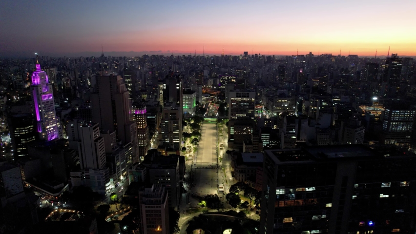 Downtown Sao Paulo at sunset time. Evening sky. Dawn sky. Sunset sky.
Sunset cityscape of downtown Sao Paulo city aerial view. Illuminated city at evening sky. Sao Paulo, Brazil. Sunset skyline city. 
