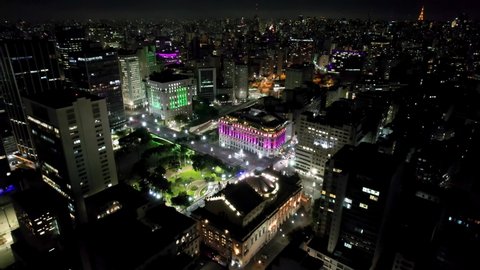 Night skyline downtown São Paulo city. Night scape aerial view of building landmark of Sao Paulo city. Cityscape of famous illuminated buildings of downtown Sao Paulo. Museum, Theatre and city hall.