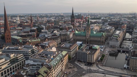 Establishing Aerial View Shot of Hamburg De, Mecklenburg-Western Pomerania, Germany, late afternoon, rathaus, busy old town