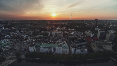 Hamburg, Germany - circa 2021: Establishing Aerial View Shot of Hamburg De, Mecklenburg-Western Pomerania, Germany, stunning sunset, TV Tower, wide