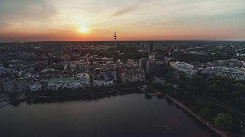 Hamburg, Germany - circa 2021: Establishing Aerial View Shot of Hamburg De, Mecklenburg-Western Pomerania, Germany, magical sunset, TV Tower, wide