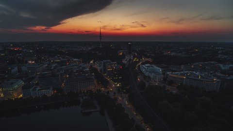Hamburg, Germany - circa 2021: Establishing Aerial View Shot of Hamburg De, Mecklenburg-Western Pomerania, Germany, colorful sunset, TV Tower