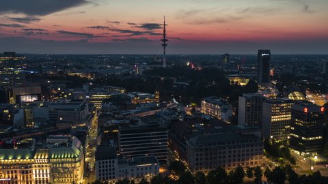 Hamburg, Germany - circa 2021: Establishing Aerial View Shot of Hamburg De, Mecklenburg-Western Pomerania, Germany, fairy tale sunset, TV Tower