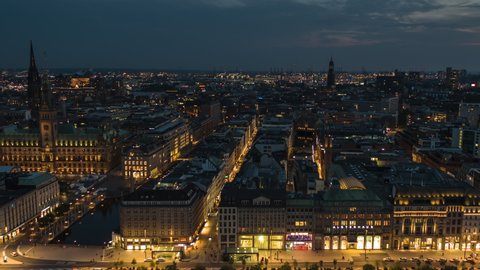 Hamburg, Germany - circa 2021: Establishing Aerial View Shot of Hamburg De, Mecklenburg-Western Pomerania, Germany, at night evening, magical old town