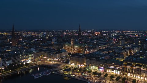Hamburg, Germany - circa 2021: Establishing Aerial View Shot of Hamburg De, Mecklenburg-Western Pomerania, Germany, at night evening, push into old town