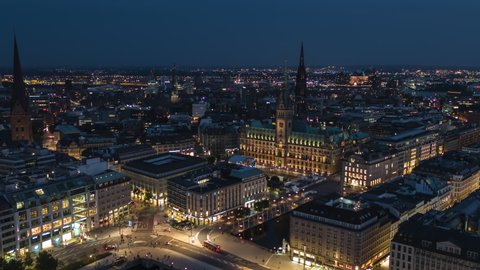 Establishing Aerial View Shot of Hamburg De, Mecklenburg-Western Pomerania, Germany, at night evening, rathaus, city falling asleep