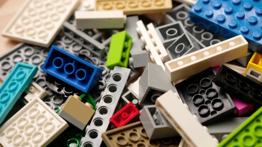 Many colorful multi-colored pieces of lego constructor bricks.  Royalty-Free Stock Footage #1081148057