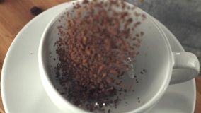 Super slow motion soluble coffee falls into the mug. Filmed on a high-speed camera at 1000 fps.High quality FullHD footage - Powered by Shutterstock - Get 15% off with code: PIKWIZARD15