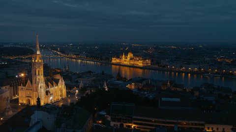 Aerial view from Budapest, Fisherman's bastation, Matthias Church with Parliament of Hungary at blue hour, sunset