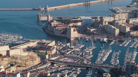 Establishing Aerial View Shot of Marseille Fr, Bouches-du-Rhone, Provence-Alpes-Cote d'Azur, France, entrance to the port, Fort Saint-Jean