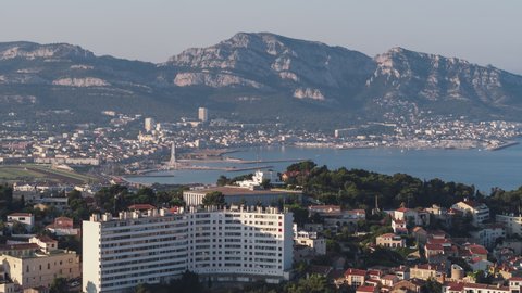 Establishing Aerial View Shot of Marseille Fr, Bouches-du-Rhone, Provence-Alpes-Cote d'Azur, France, day, long lens bay view