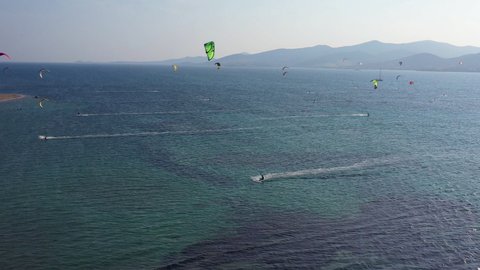 Kitesurfers in Punda beach in Paros island of Greece