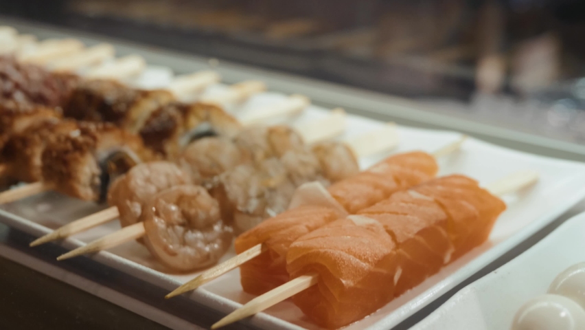 Traditional Japanese yakitori food plate close up, fish seafood