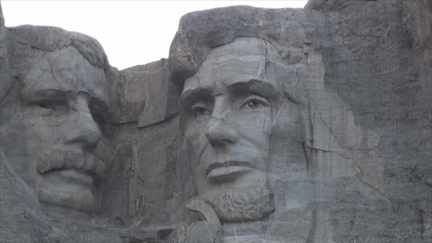 Zoom out of Mount Rushmore (National Memorial) at sunset in Keystone, South Dakota 4. A sculpture carved into the granite face of Mount Rushmore.