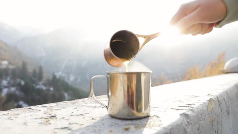 Copper Cezve for coffee in autumn mountains