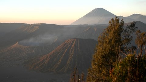 Mount Bromo, Mount Semeru, Batok active volcanoes in East Jawa, Indonesia. Sunrise view of volcanoes Mount Gunung Bromo in Tengger Semeru National Park. 4K video. Wonderful Indonesia. King Kong hill.