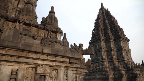 Hindu temple Prambanan in Yogyakarta, Indonesia. Prambanan Temple an ancient architecture, stupas, statues, carved stone walls. UNESCO Hinduism Complex close to Yogyakarta. 4K video.