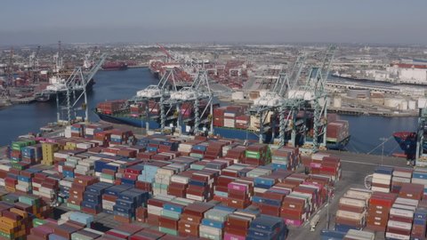 Long Beach, California, USA - October 20th, 2021: Thousands of commercial shipping containers on the port's ground waiting to be shipped