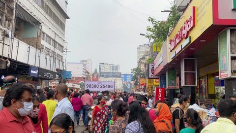 Kolkata , India - 10 22 2021: Crowded city street of Bara Bazar, a lively shopping district of Calcutta on a busy working day. Burrabazar, Kolkata West Bengal India South Asia Pacific