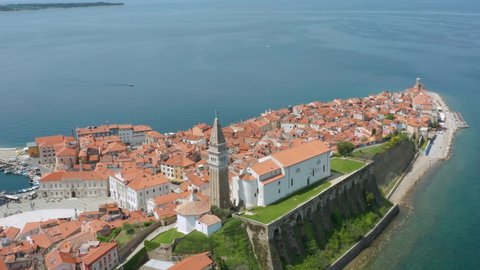 Aerial: beautiful Piran town on Adriatic coast, iconic Slovenia destination