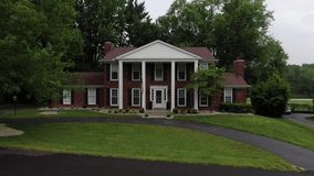 Drone Footage Pushing in on a Large Luxury House in a Luxury Neighborhood. - Powered by Shutterstock - Get 15% off with code: PIKWIZARD15