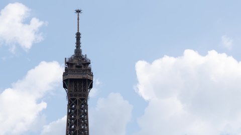 Eiffel Tower Highest Part at daytime - Timelapse with cloudsing fast in the sky