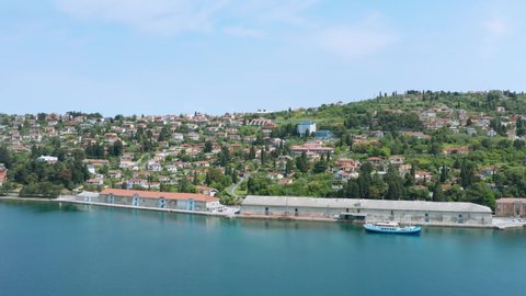 Aerial: Slovenian Piran town on Adriatic coast, boat at local harbour