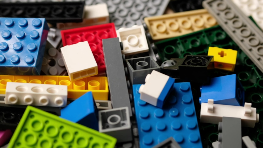 Many colorful multi-colored pieces of lego constructor.  Royalty-Free Stock Footage #1081252895