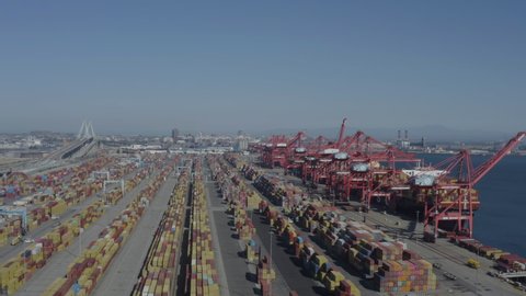 Long Beach, California, USA - October 20th, 2021: Intermodal vessels unloading hundreds of shipping containers in port of Long Beach
