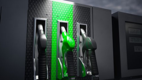 Close up on fuel dispenser with gas pump nozzle with a green handle and leaf symbol. Concept of eco-friendly fuels for transportation. Biodiesel. Refuel car with eco petrol at the gas station.