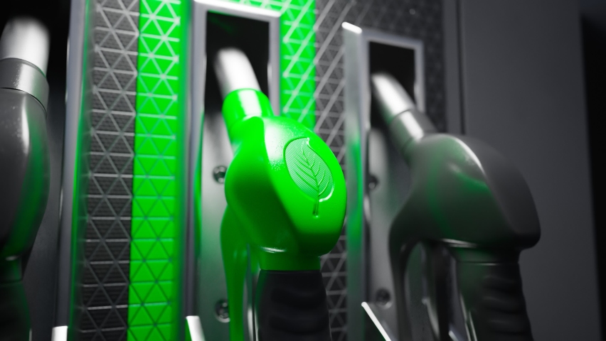 Close up on fuel dispenser with gas pump nozzle with a green handle and leaf symbol. Concept of eco-friendly fuels for transportation. Biodiesel. Refuel car with eco petrol at the gas station. | Shutterstock HD Video #1081258316